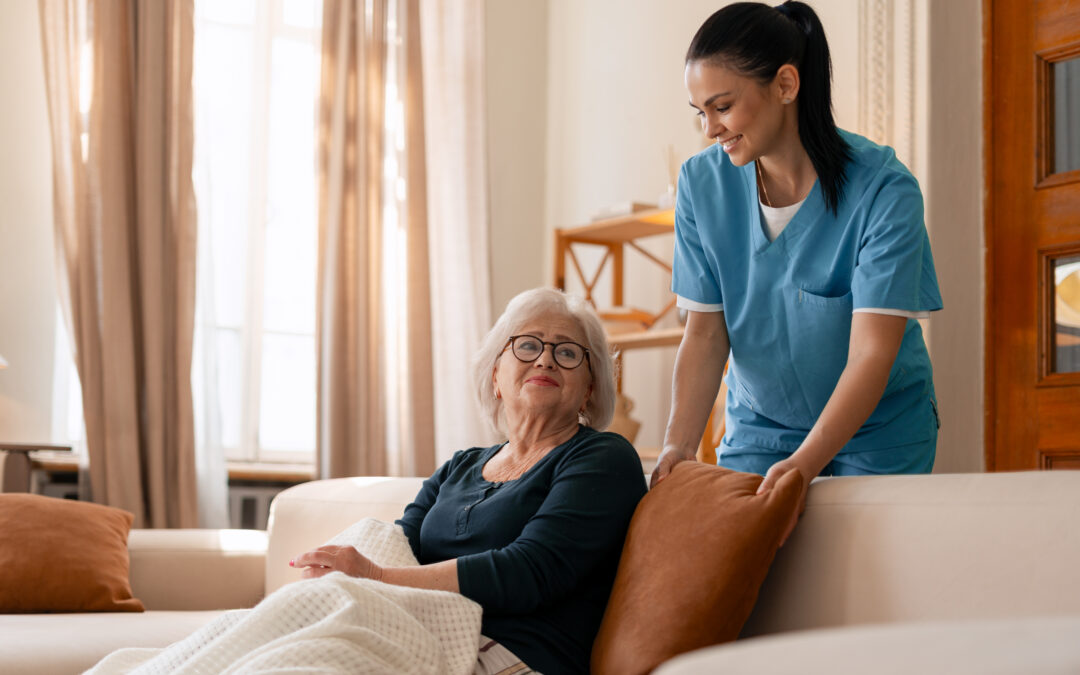 Professional caregiver providing 24-hour home care in Cherry Hills Village, CO, assisting a senior with personal care, meal preparation, medication reminders, overnight supervision, and daily living activities through Extended Family Home Care.